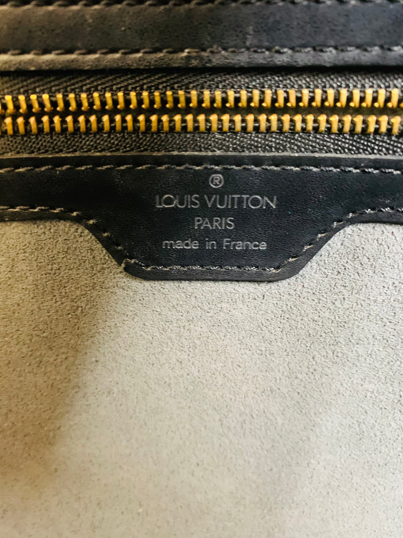 LOUIS VUITTON, Lussac bag in black epi leather and gold …